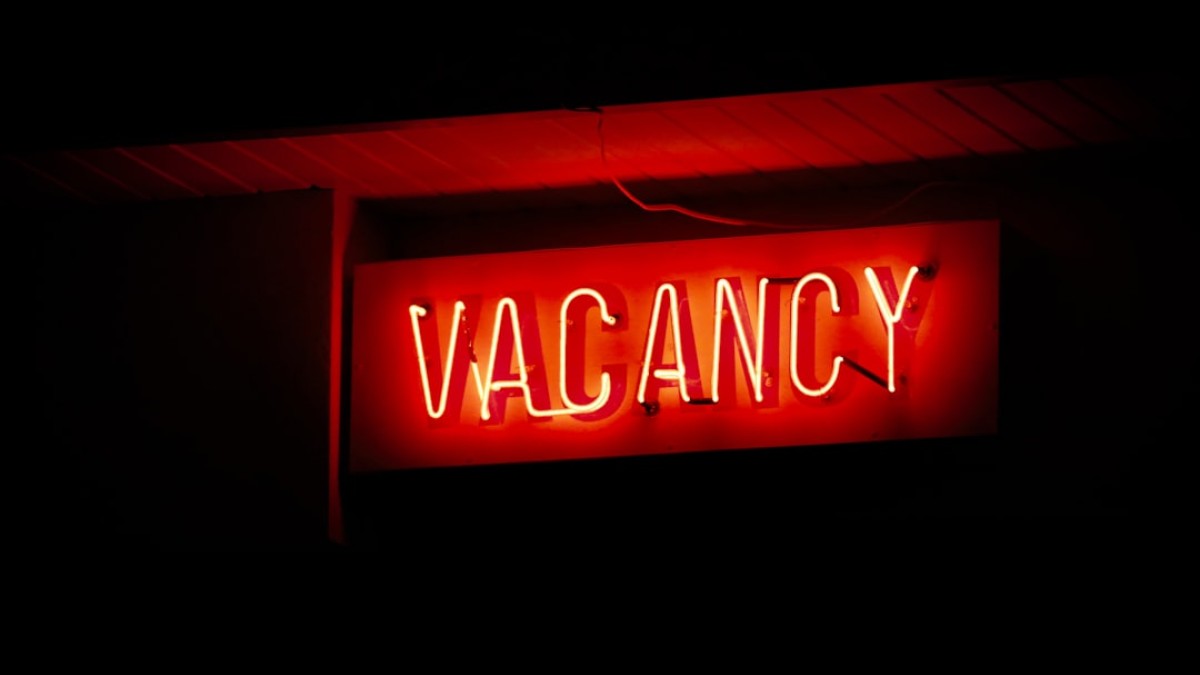 a red neon sign that says vacancy
