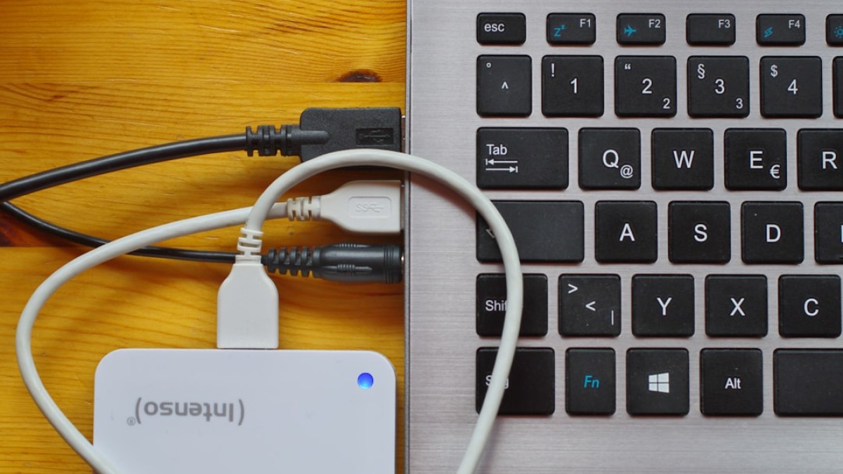 white usb cable on gray laptop computer
