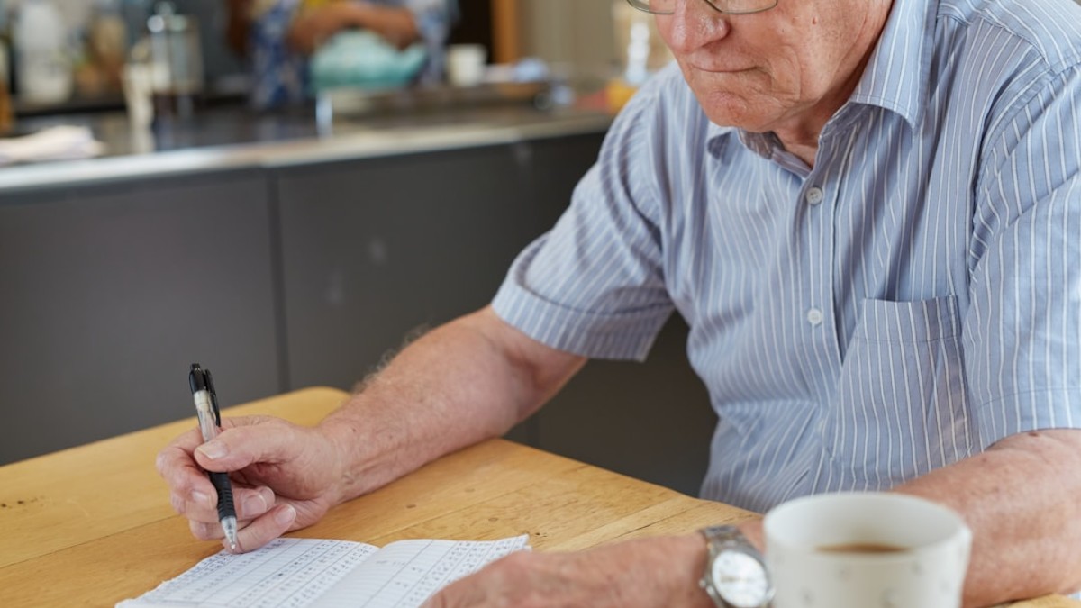 a person writing down blood glucose results