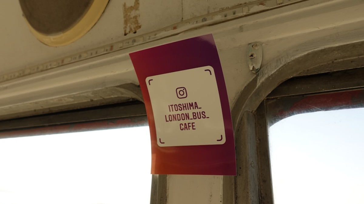 a sign on the side of a train near a window