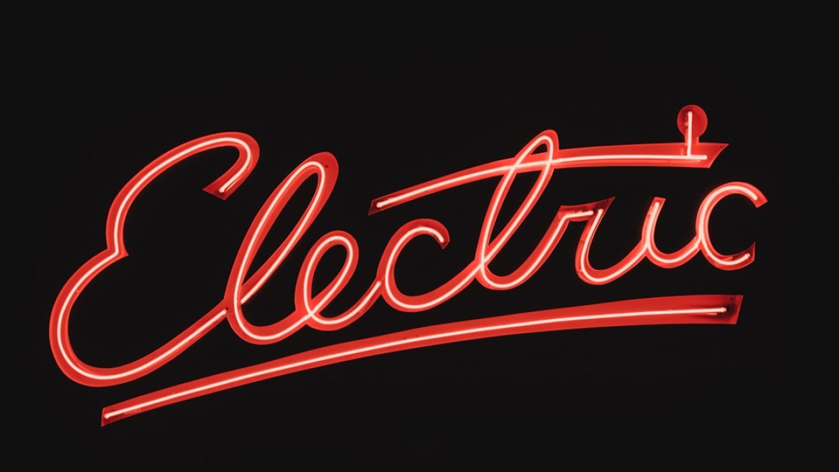 a close up of a neon sign that reads electric