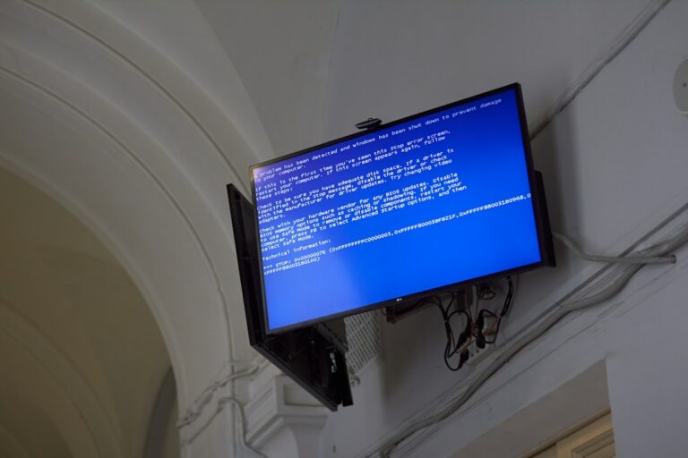 The TV displays a blue screen of death.