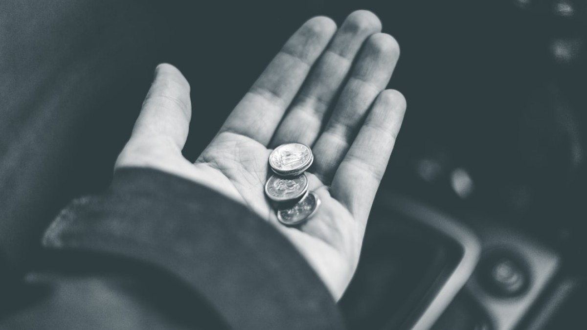grayscale photo of person wearing ring