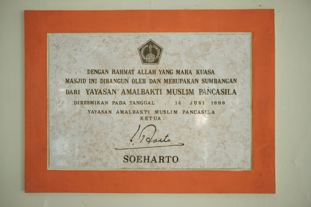 a plaque on the wall of a building