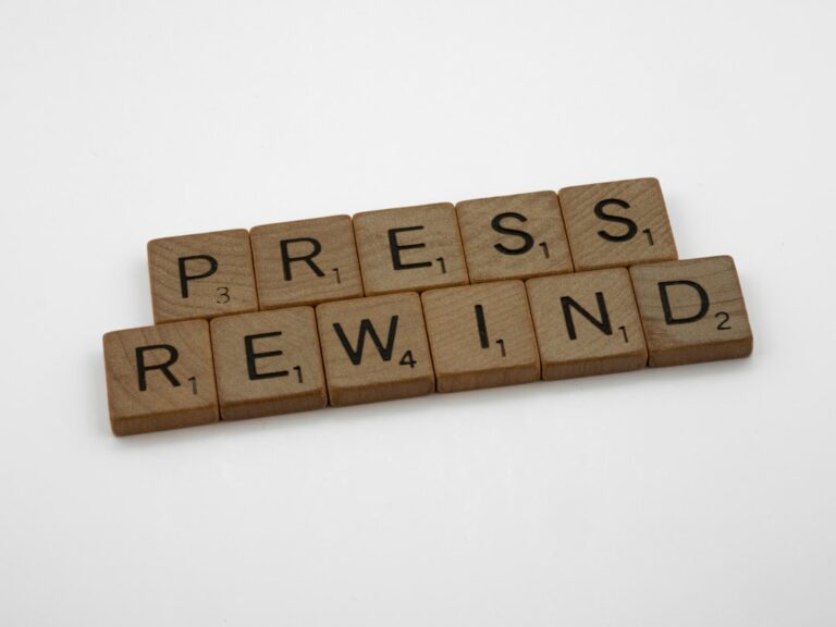 a scrabble of words spelling press, rewind, and press