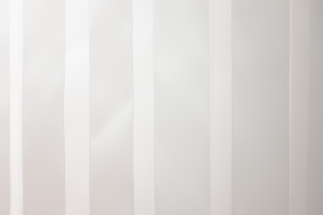a white wall with vertical lines painted on it