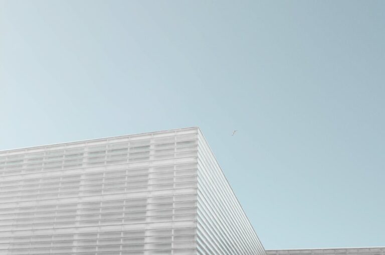 grey concrete building under clear blue sky