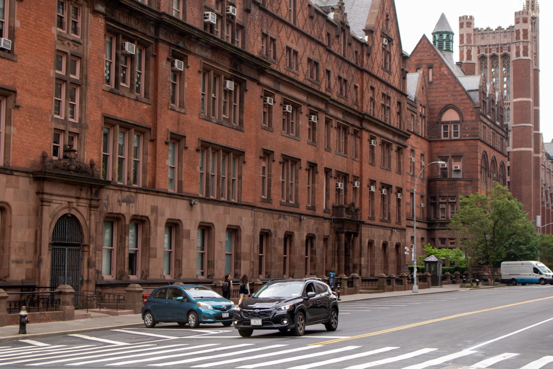 A city street with cars parked on the side of it