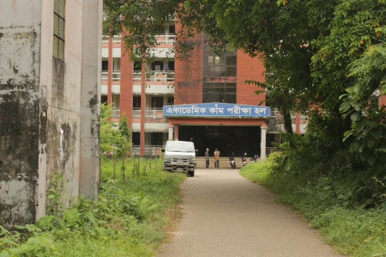 A truck is parked in front of a building